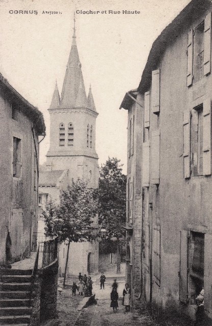 Cornus aveyron l eglise et rue haute cpa