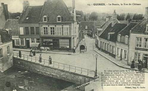 Guines pas de calais la rue du chateau et le bassin cpa